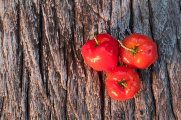 Acerola plody na pozadí — Stock fotografie