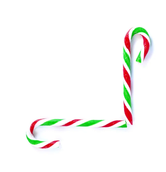 Caramelo de caña de menta de Navidad de cerca en blanco — Foto de Stock