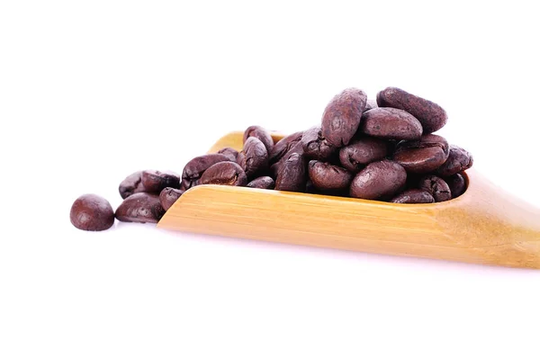 Los granos de café se cierran sobre fondo — Foto de Stock