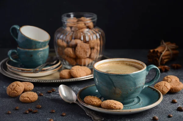 Cup of fresh coffee with Amaretti cookies on dark background — Stock Photo, Image