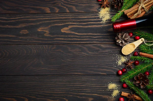 Mulled wine ingredients on a dark wooden background. — Stock Photo, Image
