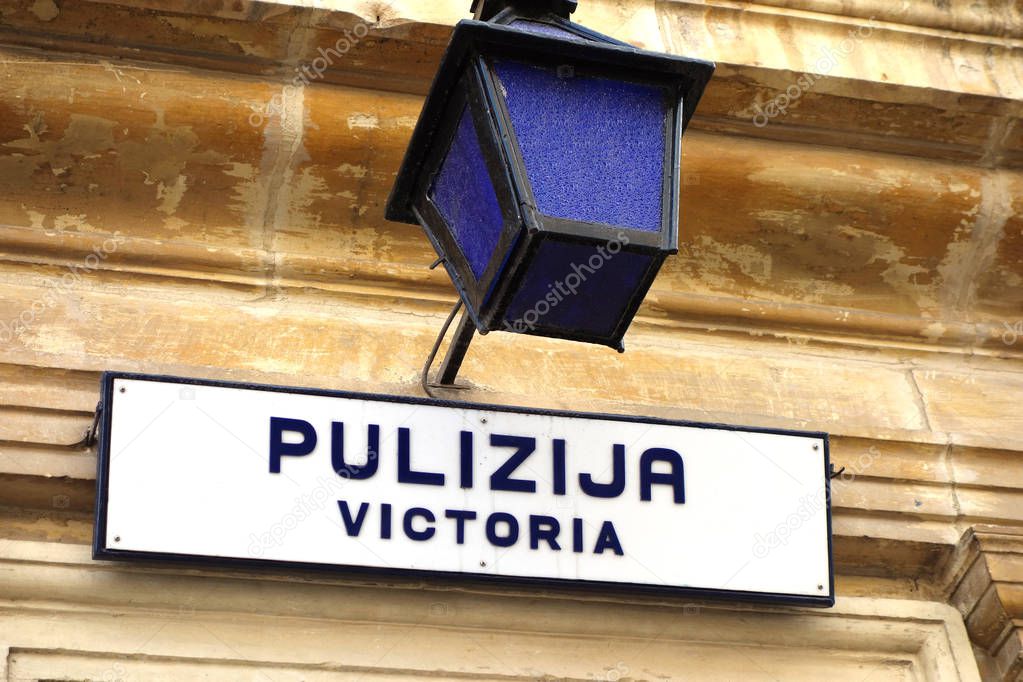 Sign of the Victoria Police Force (Pulizija) falling under the responsibility of the Ministry for Home Affairs and National Security of Malta