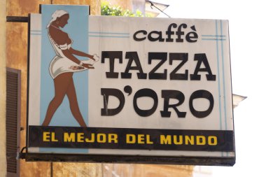 Rome, Italy - August 9, 2018: Signage of La Casa Del Caff Tazza D'oro, historical local coffee shop where baristas serve up celebrated iced granita with whipped cream layers clipart