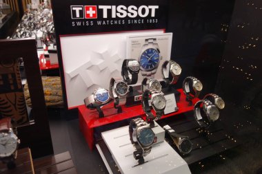 Brussels, Belgium - December 24, 2019: Tissot watches displayed in a store window. Tissot is a Swiss luxury watchmaker, subsidiary of The Swatch Group clipart