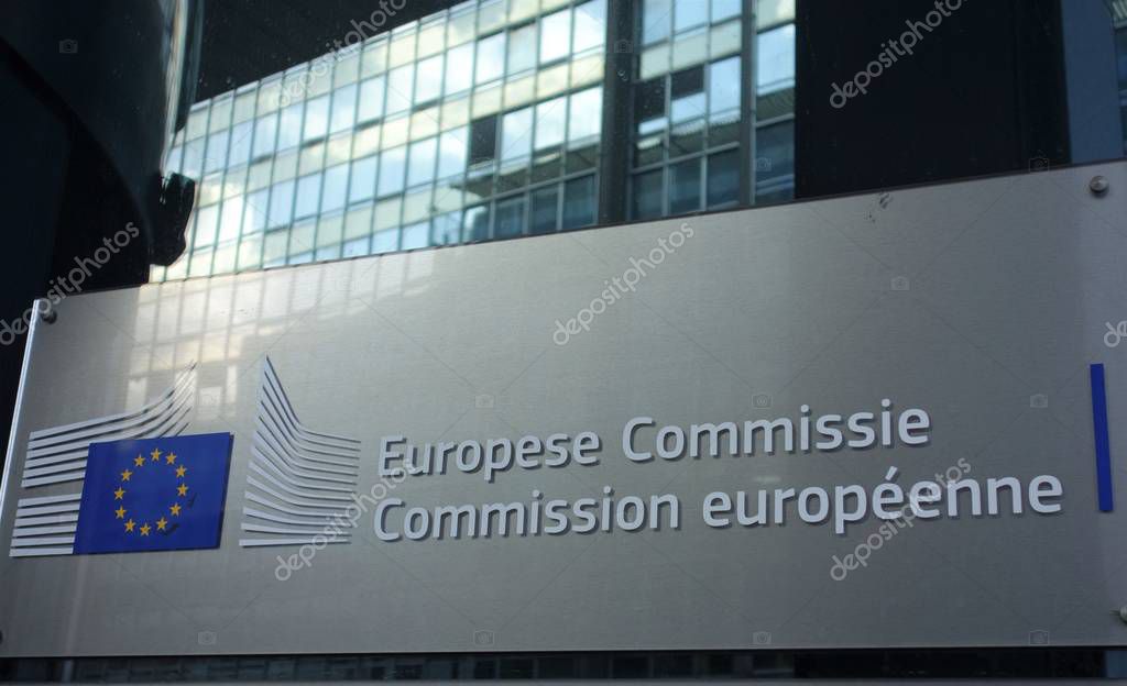 Signage of the European Commission at the entrance of the Berlaymont building, headquarters of the European Commission