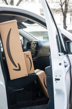 Berlin, Germany - January 27, 2020: Amazon Prime cardboard boxes in a white delivery van