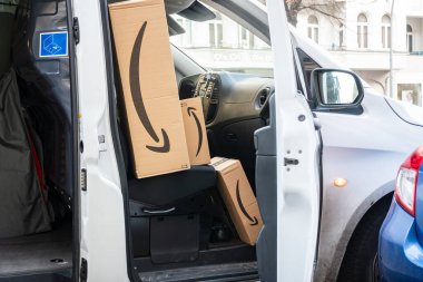 Berlin, Germany - January 27, 2020: Amazon Prime cardboard boxes in a white delivery van