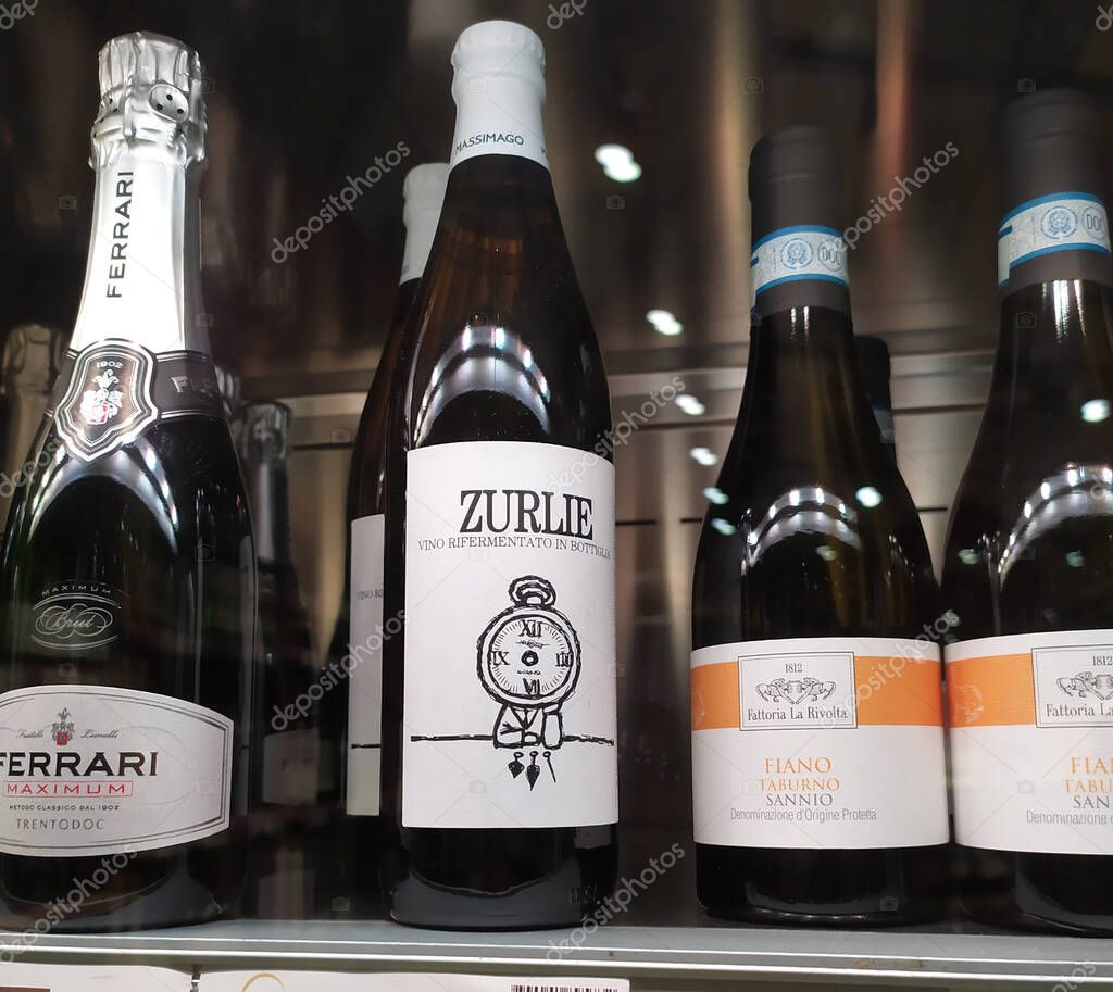 Rome, Italy - November 17, 2019: Italian bottles Ferrari Maximum Brut, Zurlie sparkling wine and Sannio Taburno Fiano wine