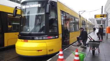 Berlin, Germany - January 9, 2020: Yellow streetcar travelling through the Eastern German capital city
