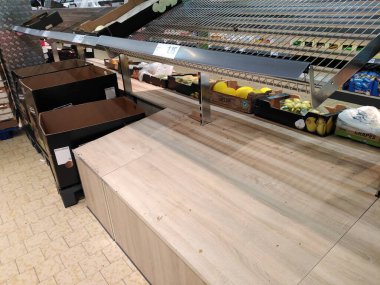Berlin, Germany - March 13, 2020: Hamster buying: empty shelves in grocery store