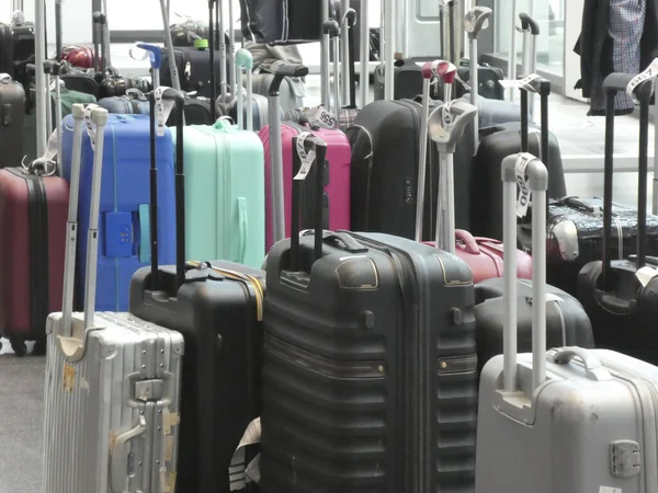 Wheeled luggage cases in a row