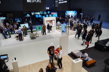 Berlin, Germany - September 10, 2019: People wandering at the exhibition place during the IFA, or Internationale Funkausstellung, trade show for consumer electronics and home appliances clipart