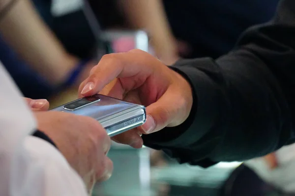 Berlin Germany September 2019 Hands Passing Galaxy Fold Samsung Foldable — стоковое фото