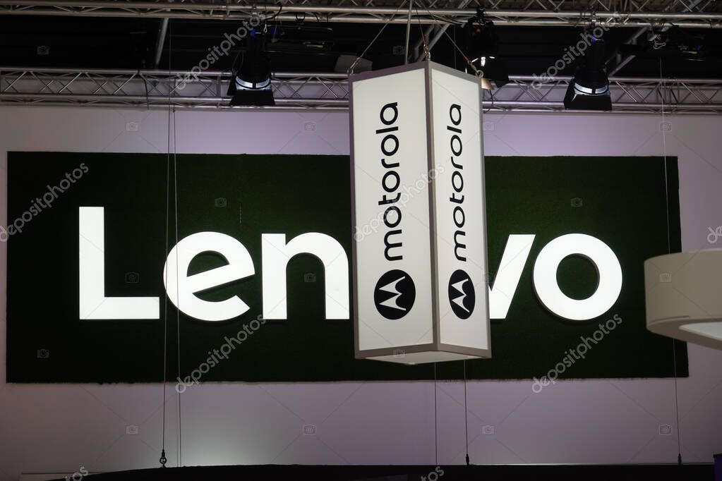 Berlin, Germany - September 10, 2019: Banners of Lenovo and Motorola Mobility, consumer electronics companies. Motorola is a subsidiary company owned by the Chinese technology firm Lenovo
