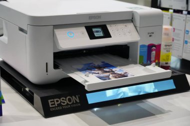 Berlin, Germany - September 10, 2019: Printer by Seiko Epson Corporation, or simply Epson, Japanese electronics company and one of the world's largest manufacturers of computer printers clipart