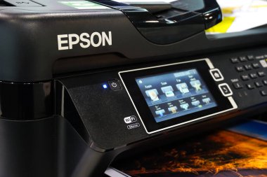 Berlin, Germany - September 10, 2019: Printer by Seiko Epson Corporation, or simply Epson, Japanese electronics company and one of the world's largest manufacturers of computer printers clipart