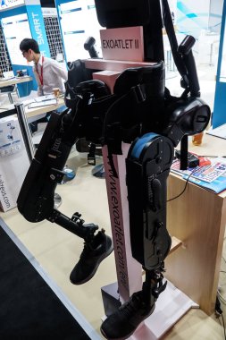 Berlin, Germany - September 10, 2019: ExoAtlet robotic leg, medical exoskeleton designed for the rehabilitation of patients with locomotive impairments to lower limbs clipart