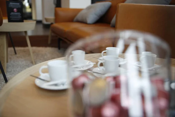 Cups and coffee capsules in a coffee shop. Selective focus