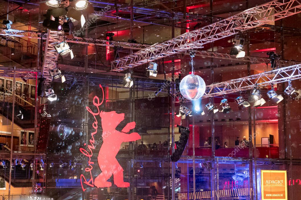 Berlin, Germany - February 11, 2017: Berlinale - Berlin International Film Festival, people are waiting for the stars on the red carpet in Potsdamer Platz. The bear is the symbol of the Festival