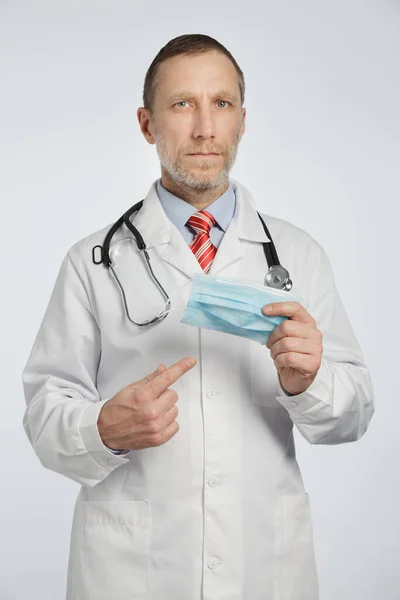 Doctor Medical Coat Stethoscope His Shoulders Shows Medical Mask — Stock Photo, Image