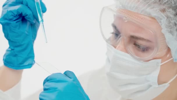 Close-up of a young employee of a large research laboratory — Stock Video