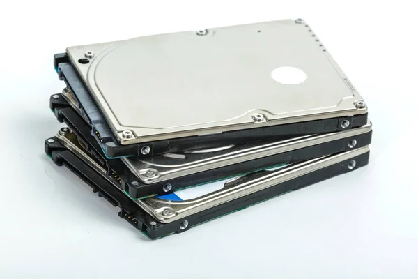 Three 2.5 inch laptop hard disk drives lie on each other. — Stock Photo, Image