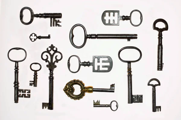 A Collection of 13 interesting  Antique Keys on white background — Stock Photo, Image