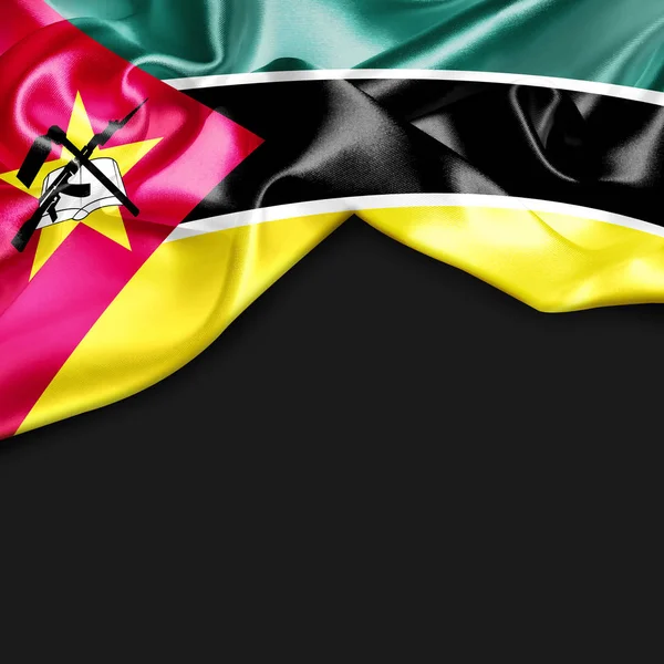 Mozambik Cumhuriyeti bayrağı sallayarak — Stok fotoğraf