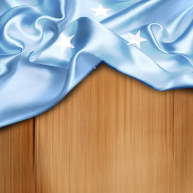 Mikronezya bayrağı sallayarak