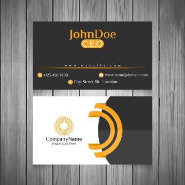 Siyah, sarı ve beyaz soyut soyut Mandala logosu ile ahşap arka plan üzerinde kartvizit