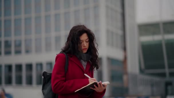 Attractive woman writer writes letter or novel in notebook — Stock Video