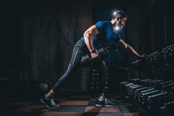 Young athlete has physical workout with barbell in modern gym — Stock Fotó