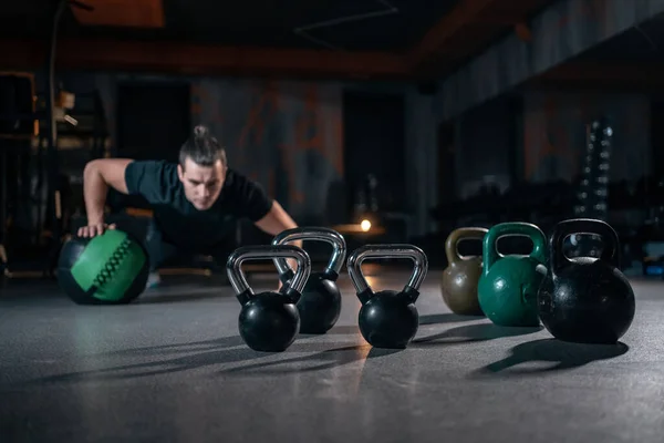 Young man has crossfit workout with weight in gym — Stock Fotó