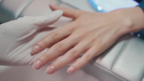 Manicure artist making nail polishing with brush and tools — Stock Video