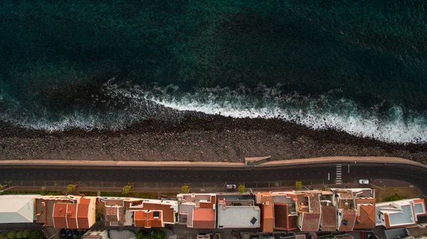 Houses on the coast of the Atlantic Ocean, Paul Do Mar, Madeira, Portugal aerial view