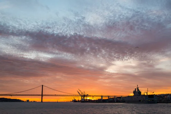 Panoramic views of the Tagus River, Bridge April 25 Lisbon and  port at sunset from ship, Portugal. — Stock Photo, Image