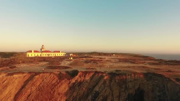Lighthouse on the beautiful cliff at sunset in Portugal — Stock Video