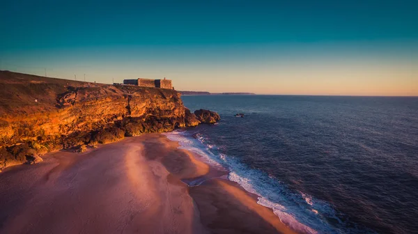 Aerial view of ocean, north Beach and Nazare lighthouse at sunset, Portugal — Stock Photo, Image