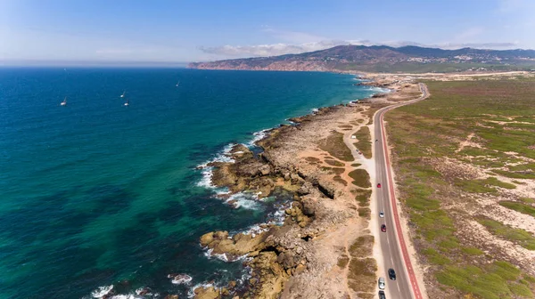 Beautiful road along the coast of ocean on sunny day, Portugal aerial view from Drone — Stock Photo, Image