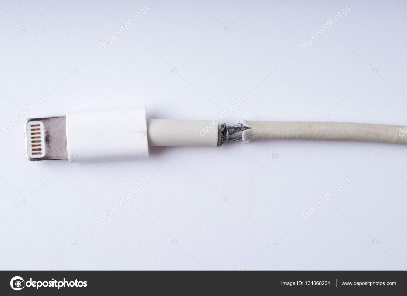 Closeup the Broken Smart Phone Charger Cable on white Background