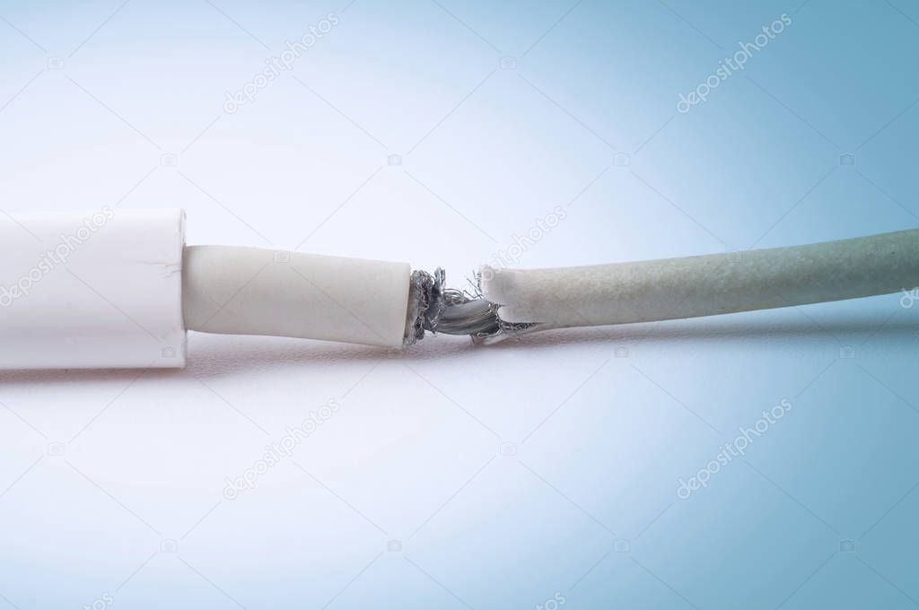 Closeup the Broken Smart Phone Charger Cable on white Background