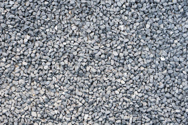 地面石材、 灰色，很多小石头背景. — 图库照片