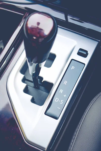 Automatic gearshift in black and white.