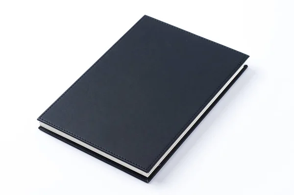 Black notebook on white background. — Stock Photo, Image