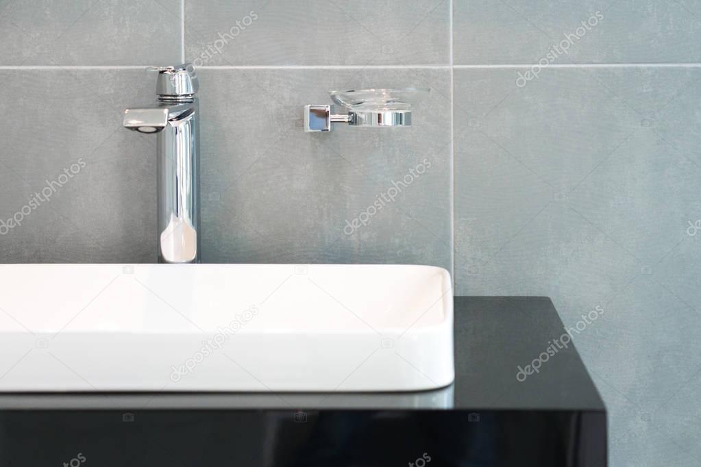 Bathroom interior with sink and faucet