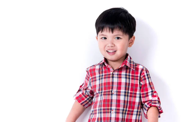 Portrait of cute asia boy in the red plaid shirt. Stock Image