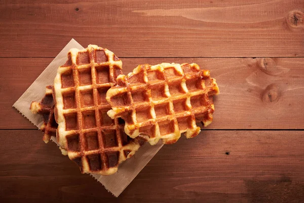 Belgian waffles on a wooden table — Stock Photo, Image