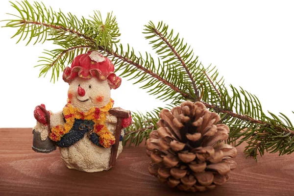 Christmas background Snowman, cones and green tree Royalty Free Stock Photos