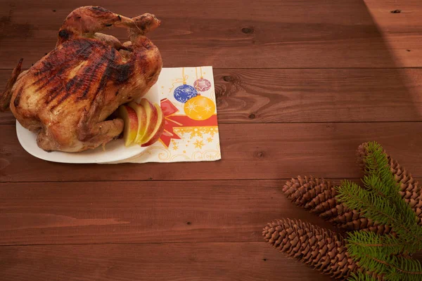 Roasted bird on a wooden table — Stock Photo, Image