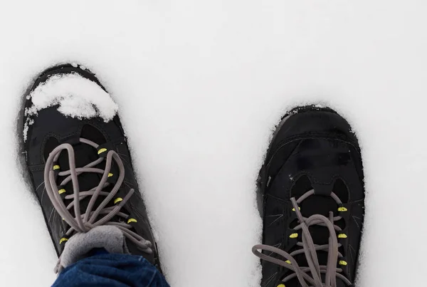 stock image feet in shoes in the white snow